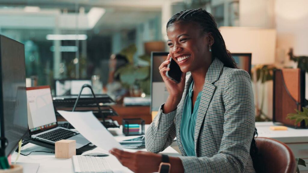 Business Woman Speaking On The Phone To Her M&A Advisor