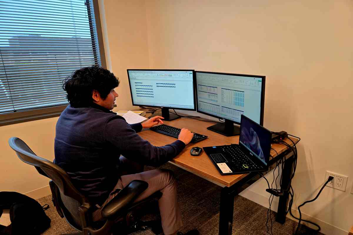 Roadmap M&A Advisor Working on Computer Near Window