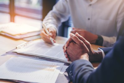 Business Owner Signing A Letter Of Intent