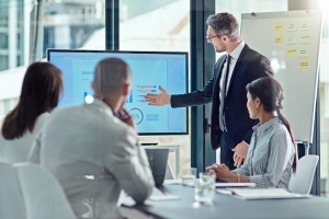 Business People Discussing Roofing Company Data for Private Equity Interest