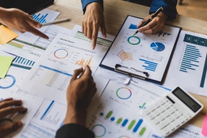 Roofing Business Team Making Strategy to Financial Reporting Using Charts